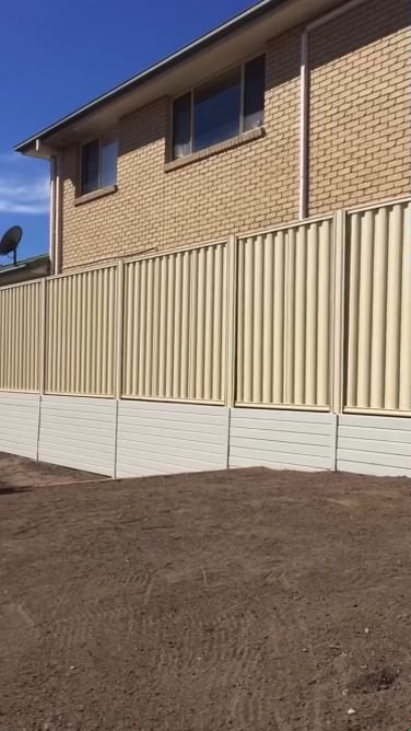 Colorbond fence with retaining wall