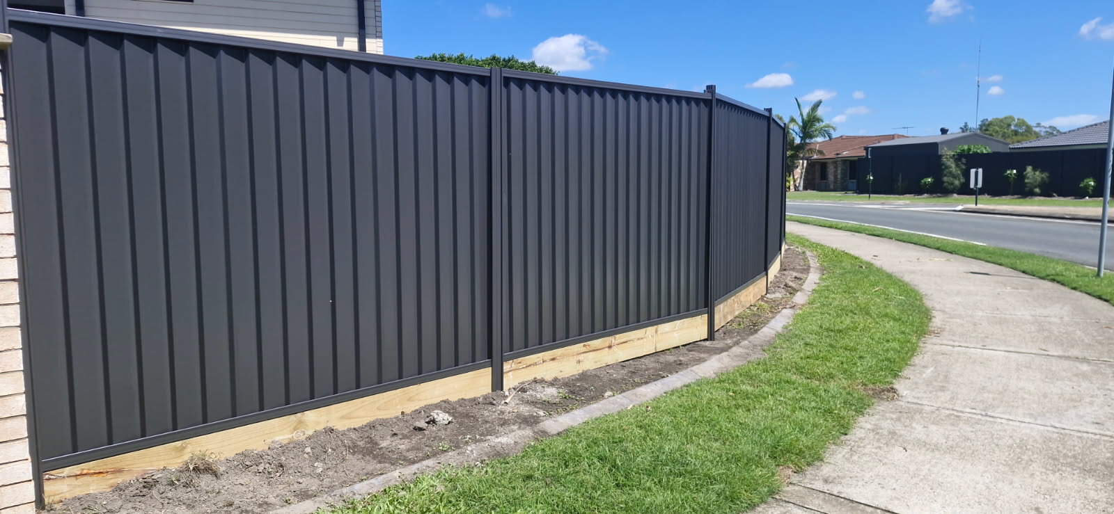 Colorbond fence with treated pine sleeper plinth